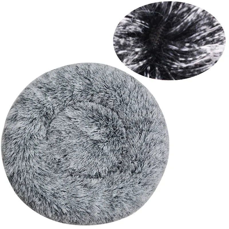 Soft plush round pet bed by Ditzy Petunia with a raised rim, washable anti-slip base, available in various sizes and colors.