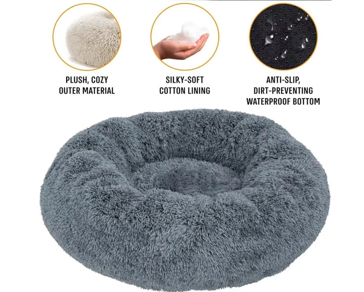 Soft plush round pet bed by Ditzy Petunia with a raised rim, washable base, available in multiple sizes and colors for dogs and cats.